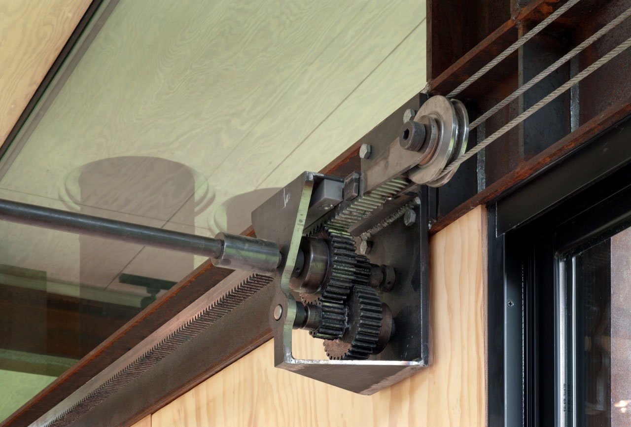 Close up of the door gears in the Delta Shelter by Olson Kundig Architects