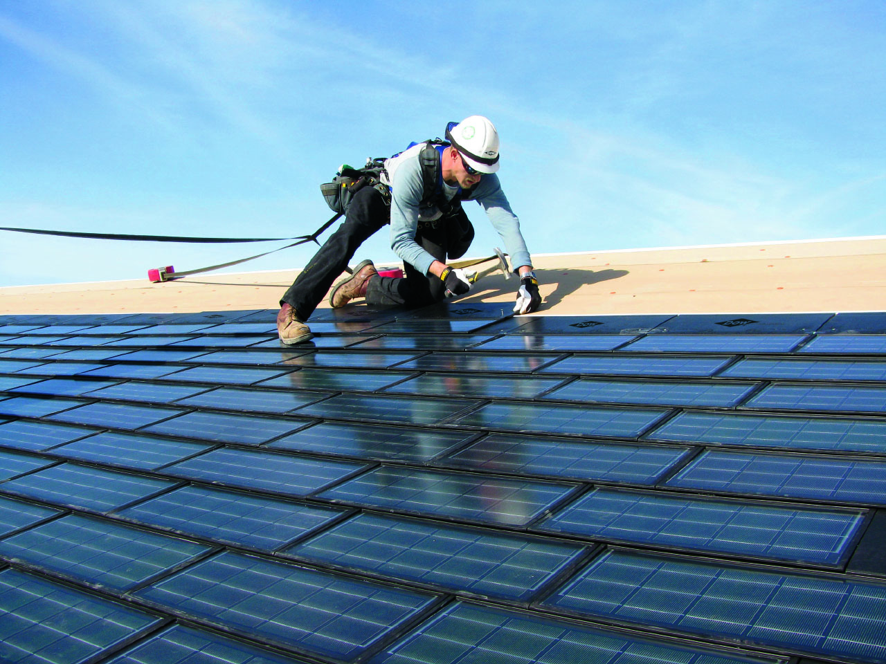 Roofer Installing DOW POWERHOUSE Solar Shingles