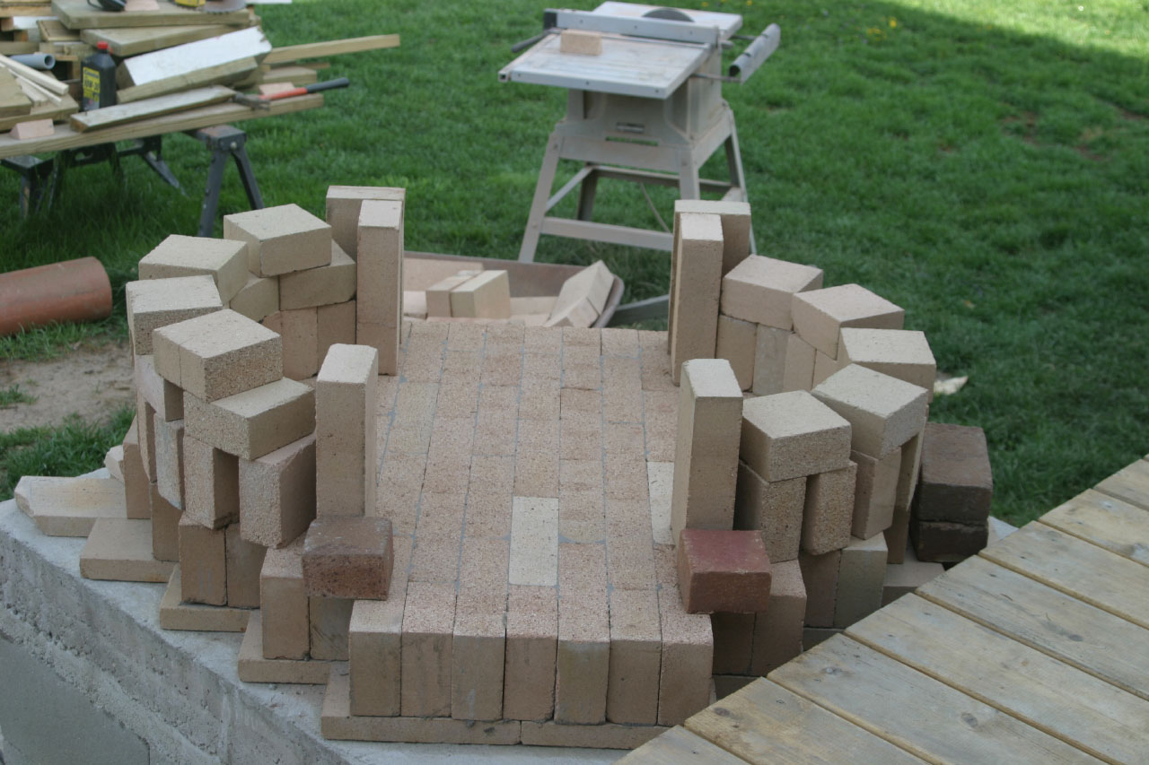 Laying out the brick for a DIY Brick Bread Oven