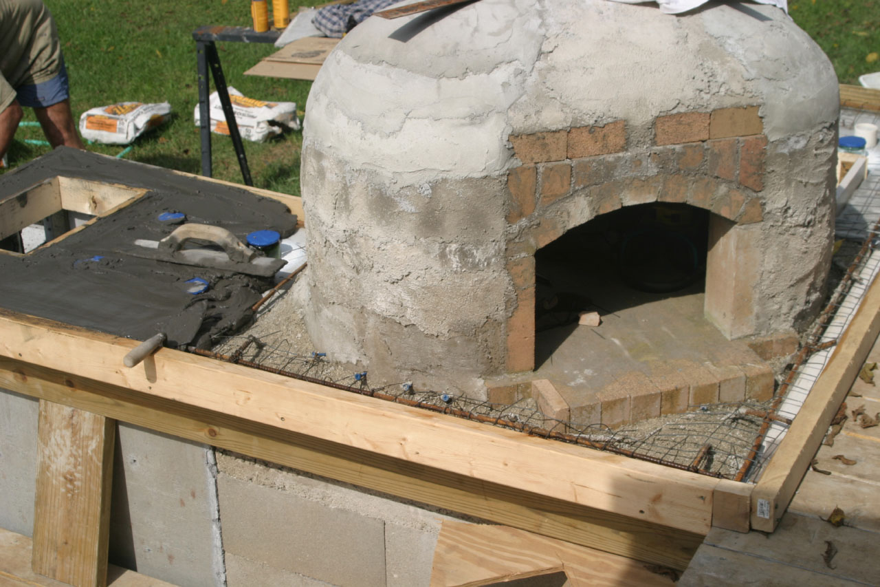 adding concrete to the DIY Brick Bread Oven