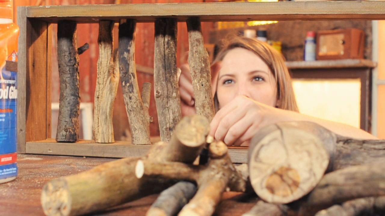 Rachael Ranney assembling an upcycled tree branch coat rack