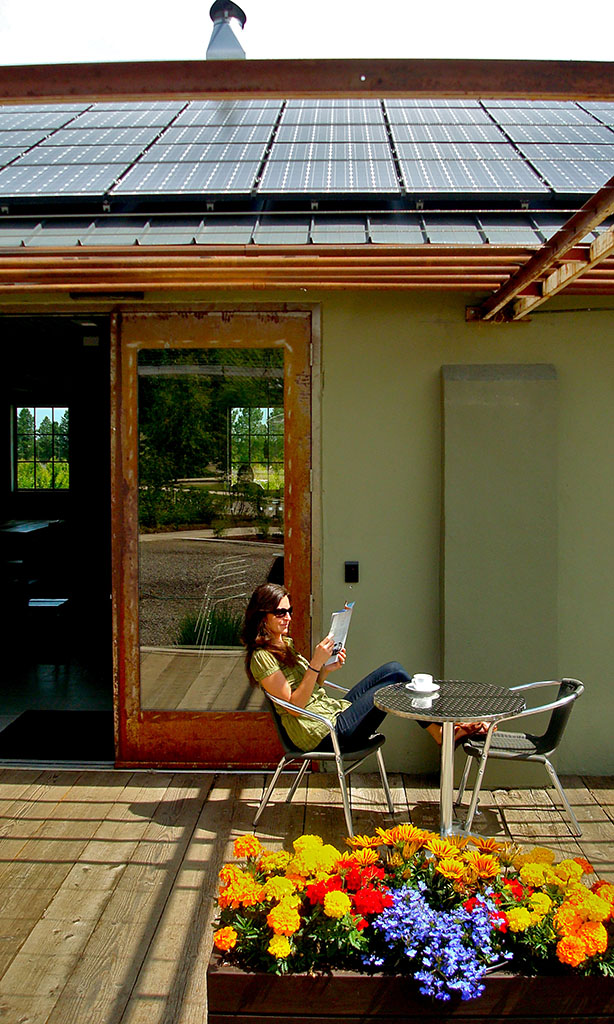 Woman on the deck of the Living Building Challenge Painter Halls