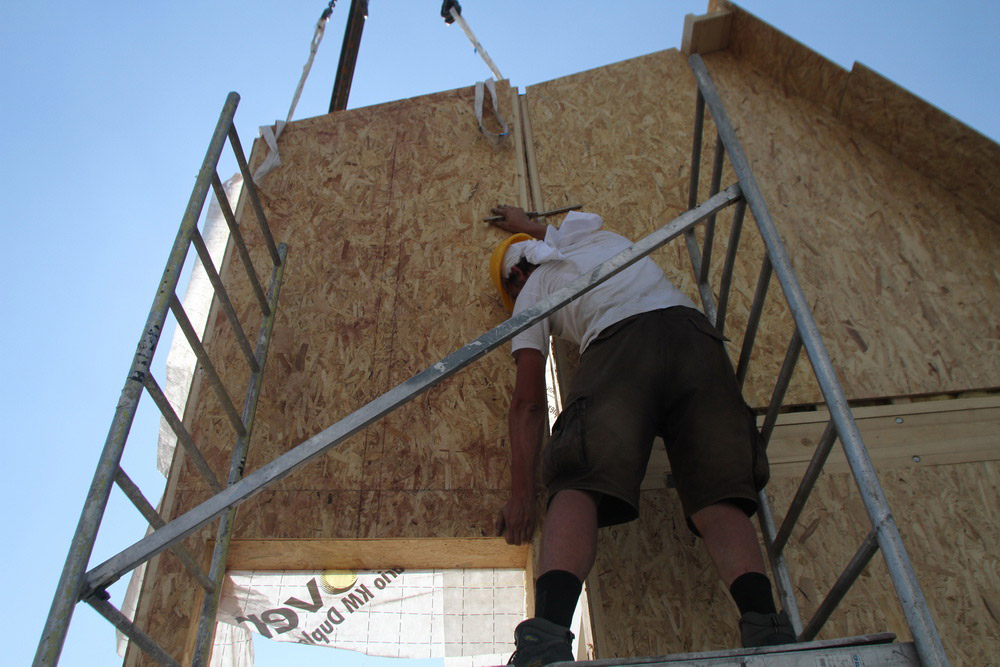 Installing OSB on PRISPA solar house.