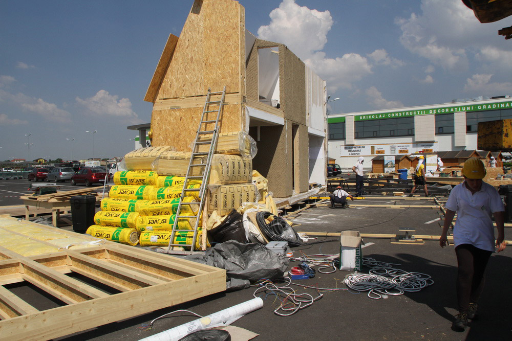 Construction workers building PRISPA house.