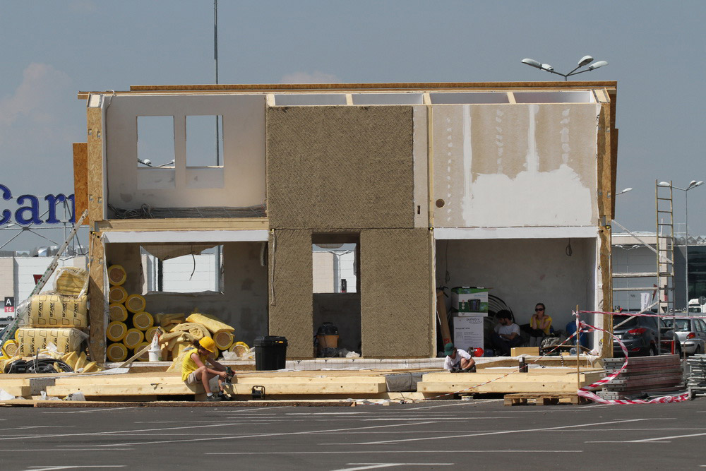 Construction workers building PRISPA house.