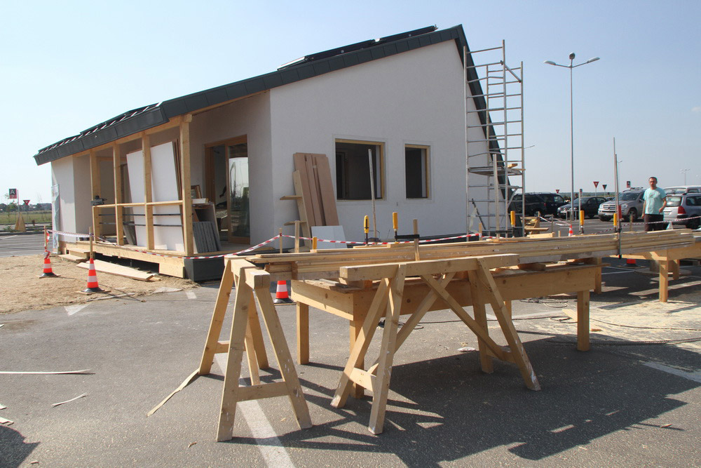 Construction workers building PRISPA house.