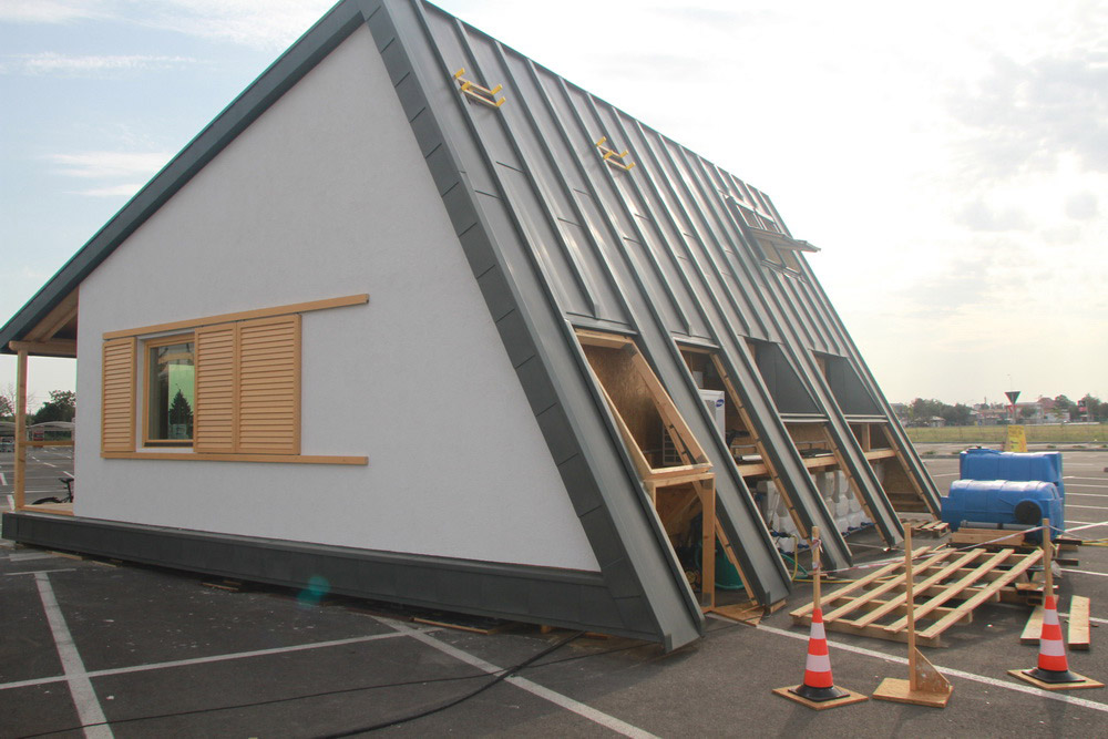 Construction workers building PRISPA house.