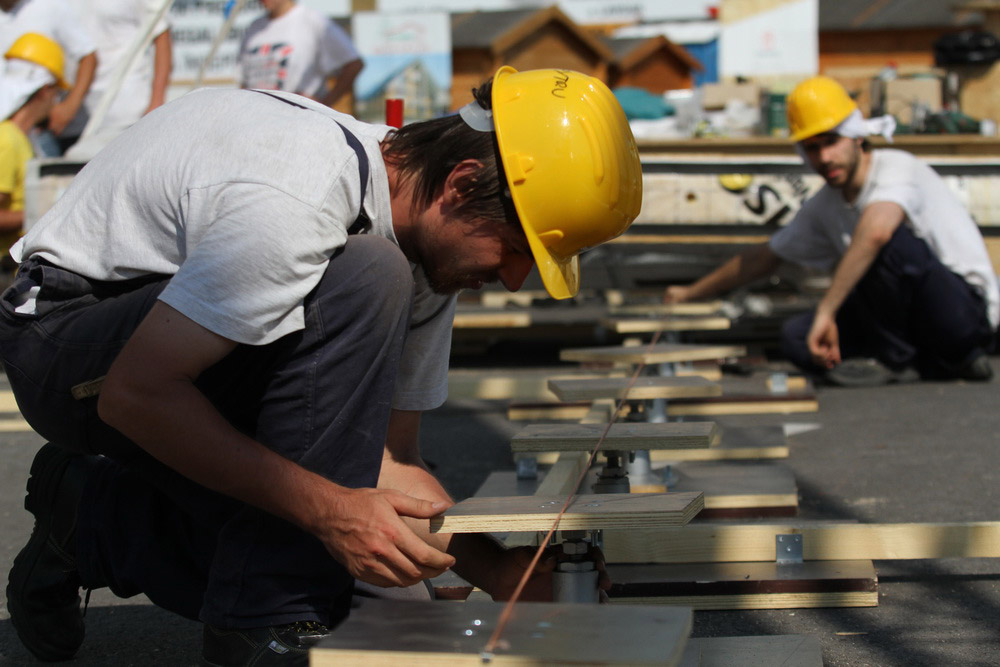 Construction workers building PRISPA house.