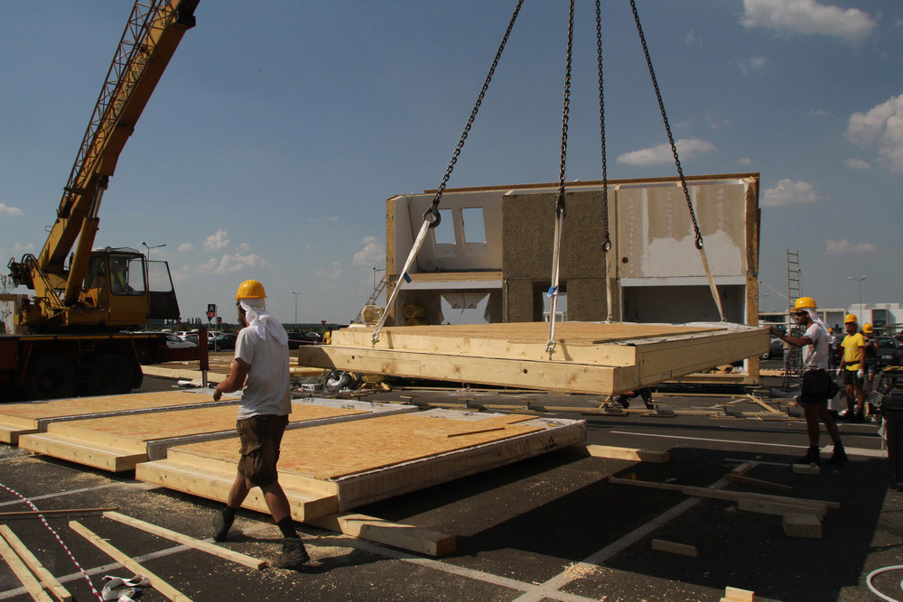 Construction workers building PRISPA house.