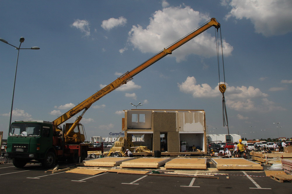 Construction workers building PRISPA house.