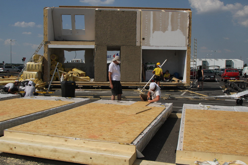 Construction workers building PRISPA house.