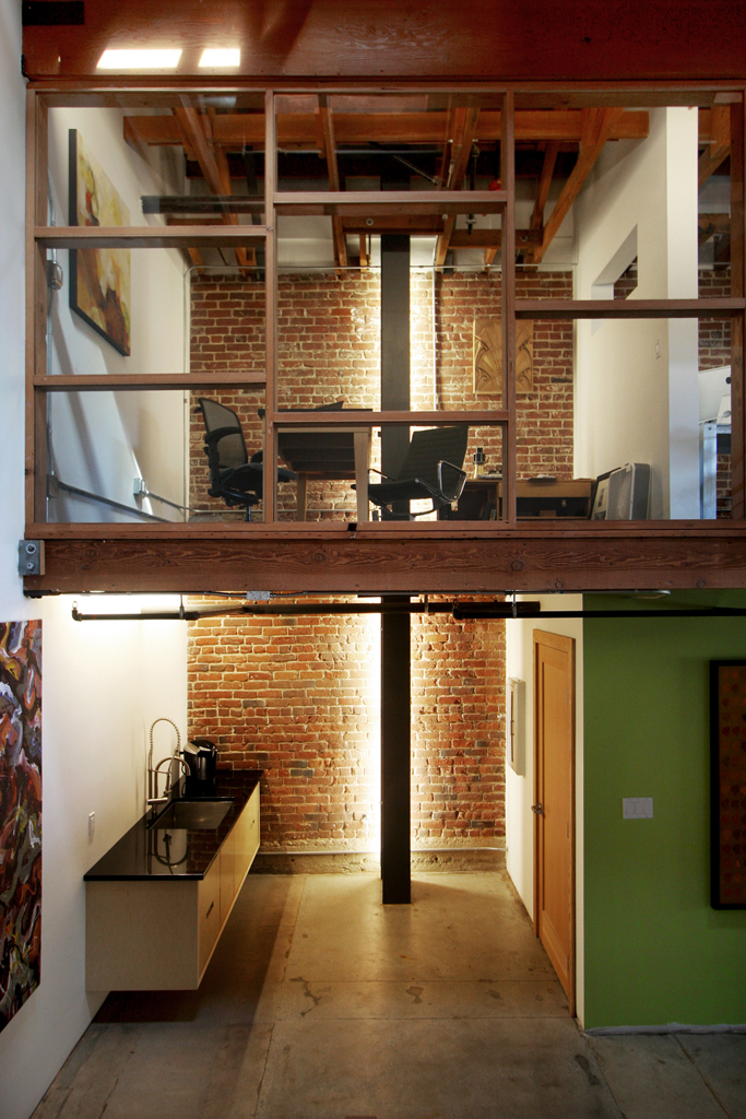 Adaptive reuse of a warehouse for office space by Studio One Eleven Architecture