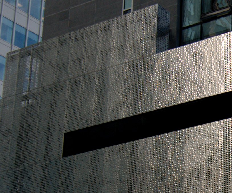 Stainless steel screen exterior of Vancouver's Fairmont Pacific Rim Hotel designed by architect James Cheng