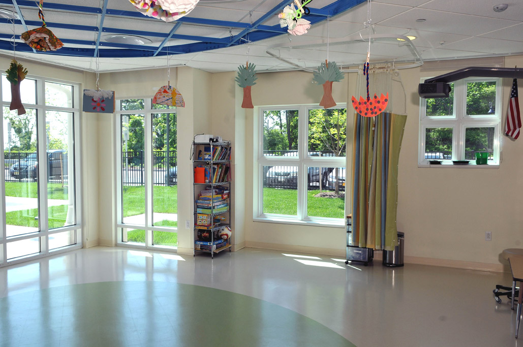 Colorful children's room is flooded with light through Simonton windows.