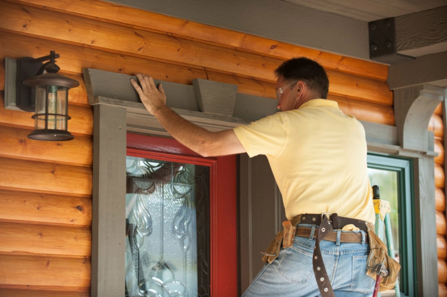 Contractor Steve Roth adds custom-made Fypon crosshead over the Therma-Tru entry door.