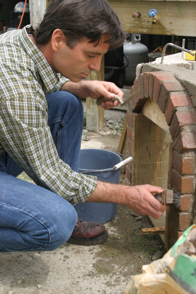 Jeff Wilson constructing a DIY Brick Bread Oven