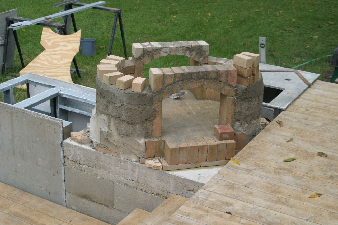 adding concrete to the DIY Brick Bread Oven