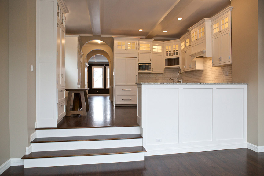 Open concept kitchen lets light travel through, opening up the space