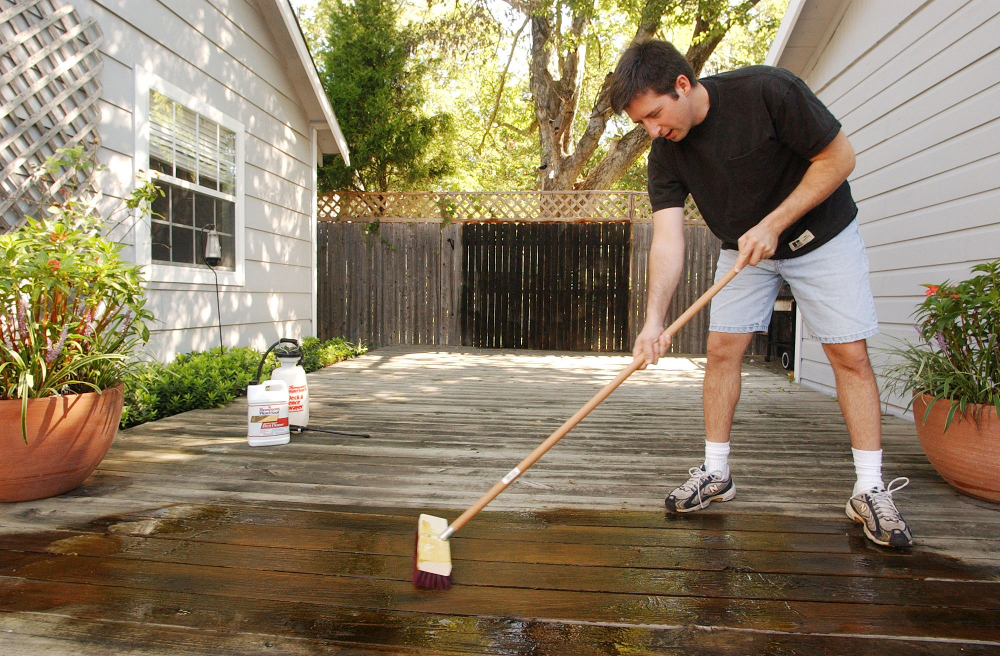 wood deck being cleaned