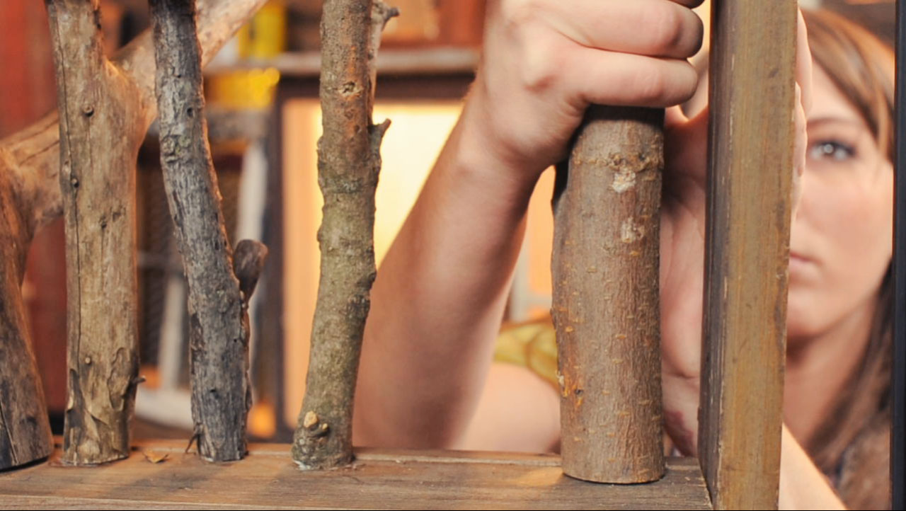 Rachael Ranney assembling an upcycled tree branch coat rack