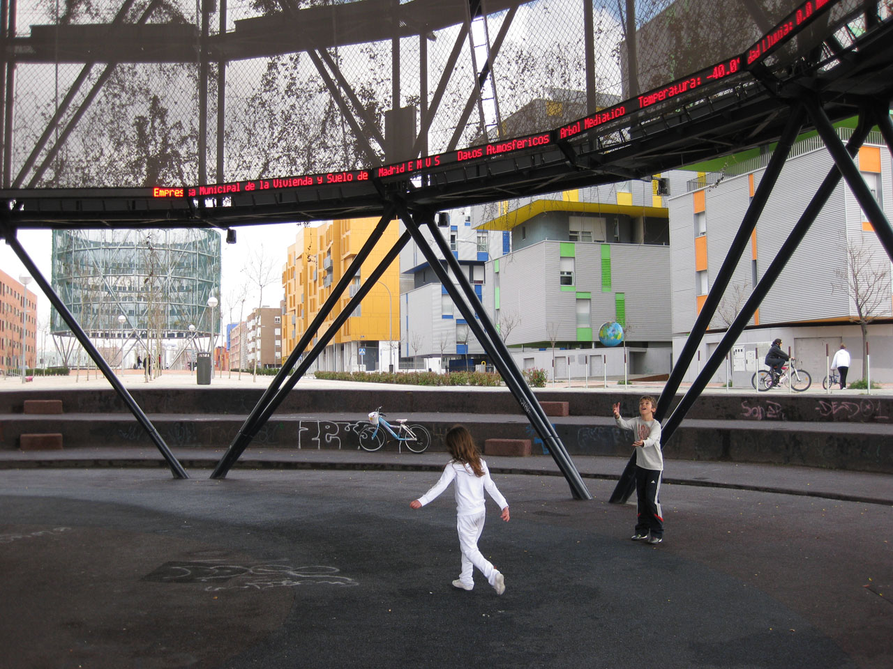 Children playing under Madrid's Eco-boulevard Air Trees by Ecosistema Urbano