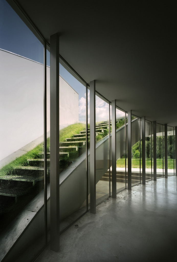 Exterior stairs leading to the green roof of the OUTrial House by Robert Konieczny
