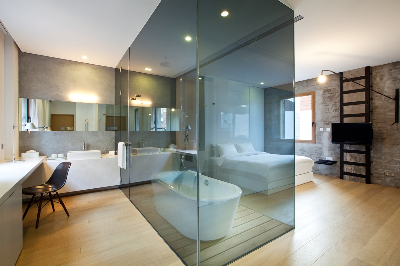 Hotel room and bathtub inside the Waterhouse at South Bund located in  Shanghai, China designed by Neri & Hu Design and Research Office (NHDRO)