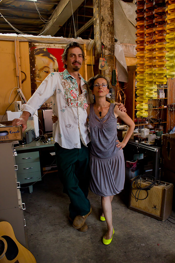  
Randy Rushton and Sabin Aell in their studio; Aell’s sculpture utilizing pool land divider floats can be seen in the background.
Photo: Lauri Lynnxe Murphy