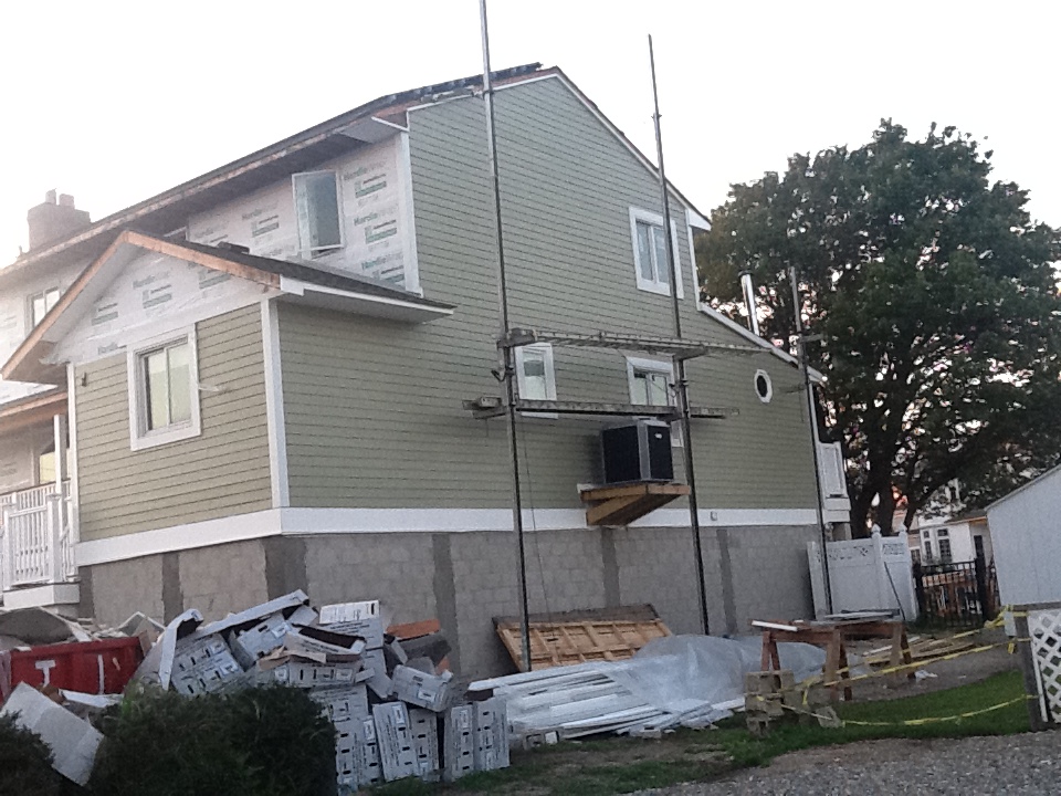 House with weather barrier and fiber cement siding