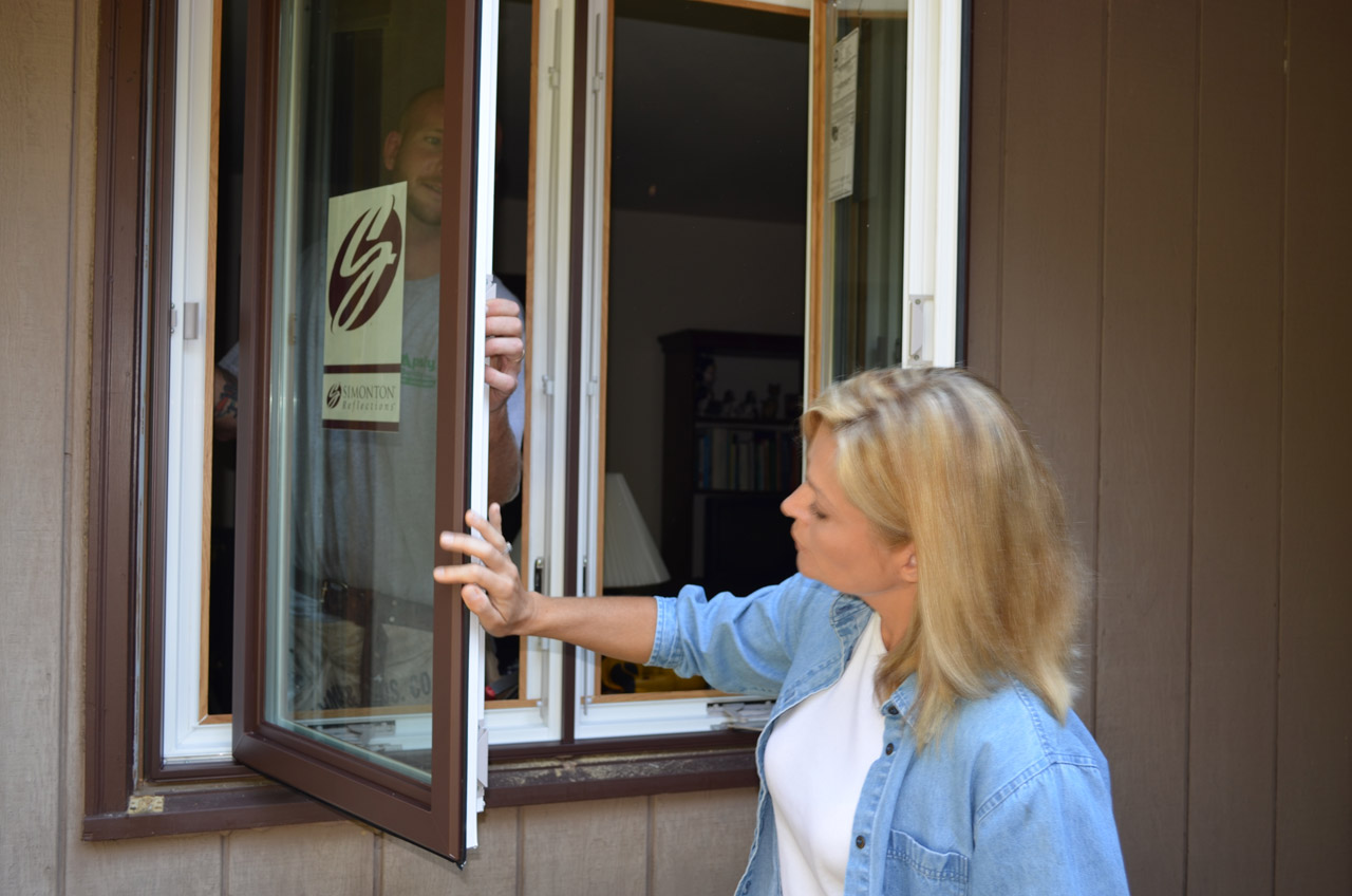 Dr. Anna Marie inspects chocolate finished on Decorum by Simonton windows.