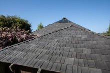 Steep Roof Pitch No Problem for Roofer Installing Polymer Shake Tiles